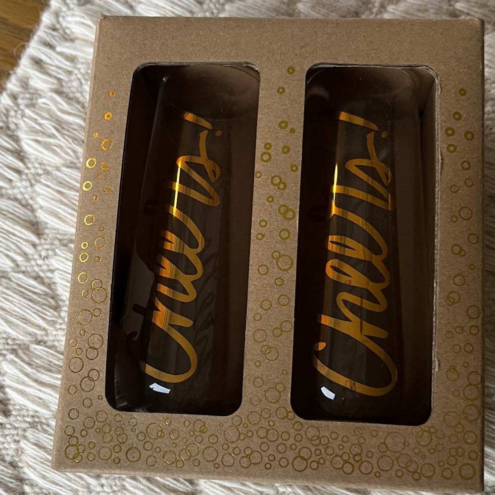 New in box Paper Source Stemless Champagne Glasses with Gold Cheers Text